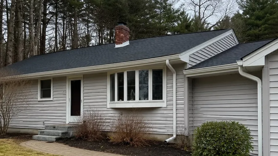 Same home in Lowell, MA after gutter replacement, with a new gutter system installed