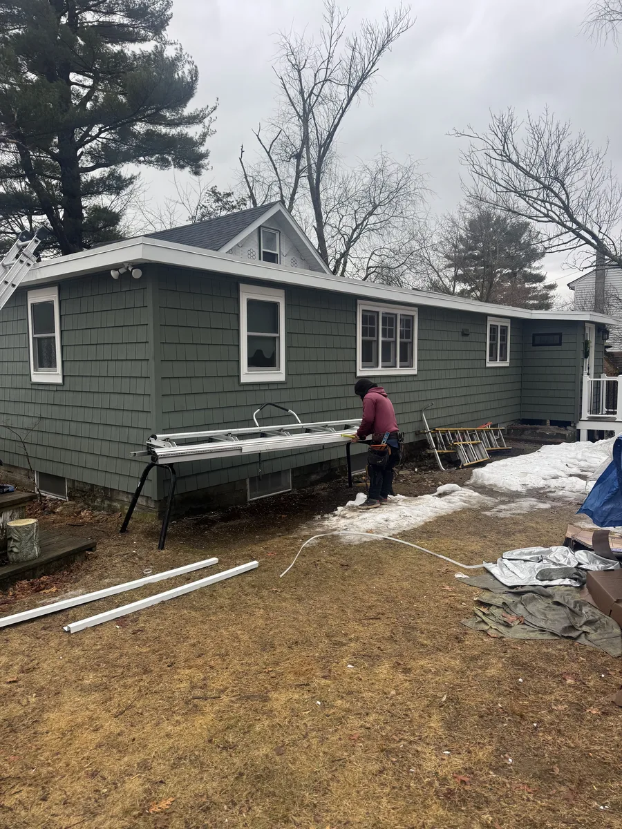 Siding installation in progress on a home in Lowell, MA