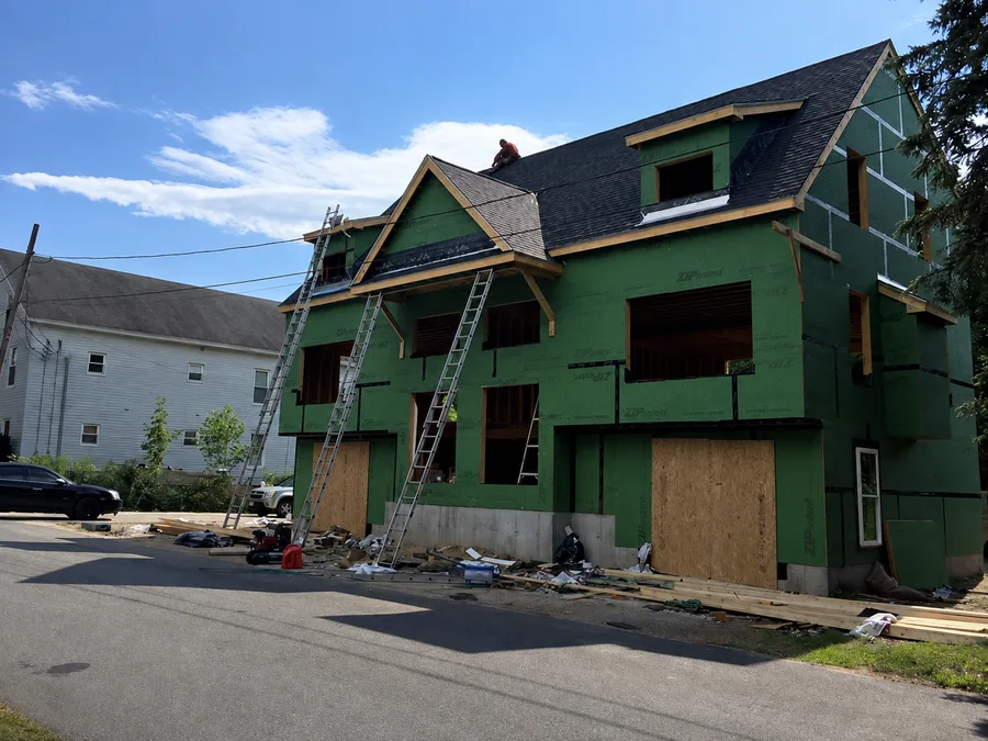 Home wrapped in sheathing and ready for new siding installation