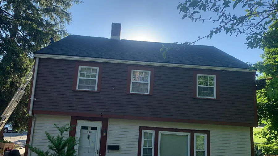 Finished two-tone siding and trim installation on a home in Lowell, MA