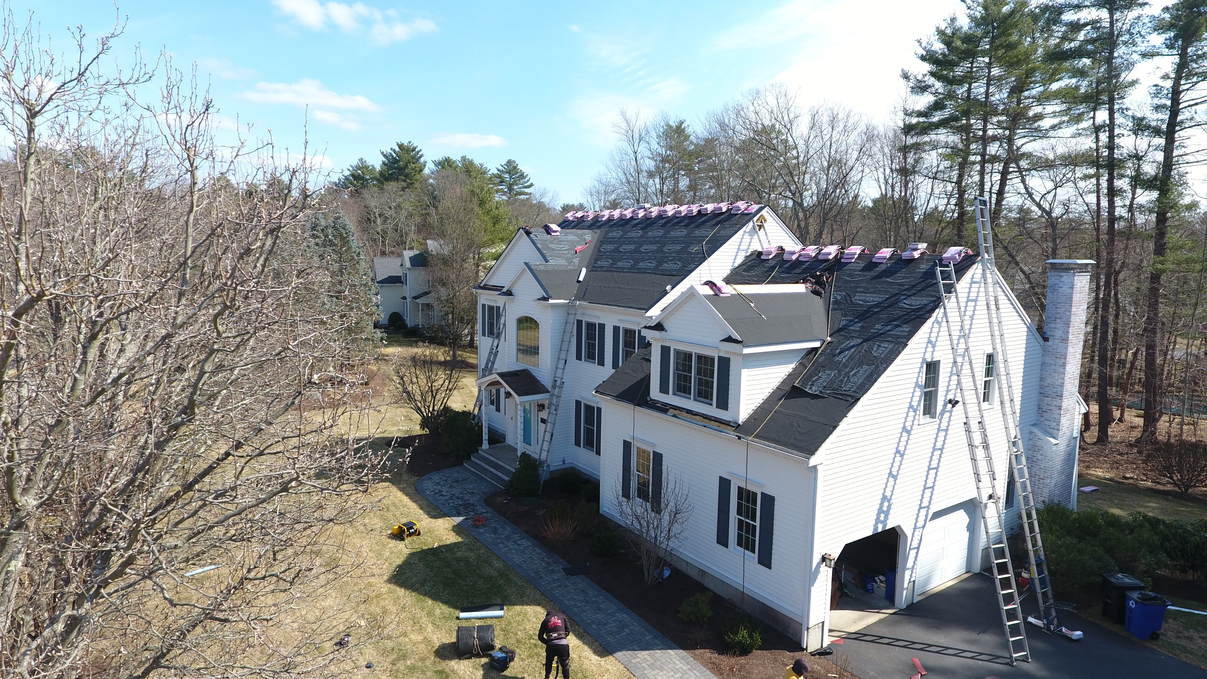 Â Certified roofing crew installing CertainTeed shingles on residential property in New Hampshire
