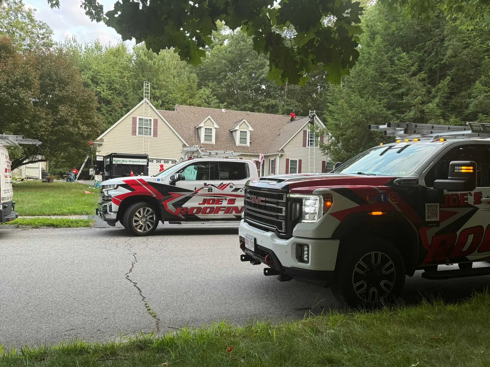 Slate roof restoration showing careful tile replacement maintaining original 1920s character