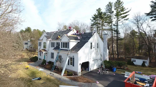 Emergency roof leak repair showing water damage stains on ceiling before repair