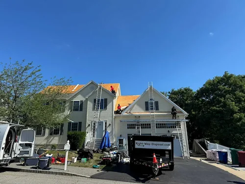 Complete roof replacement project showing new Owens Corning Duration shingles installed on colonial home