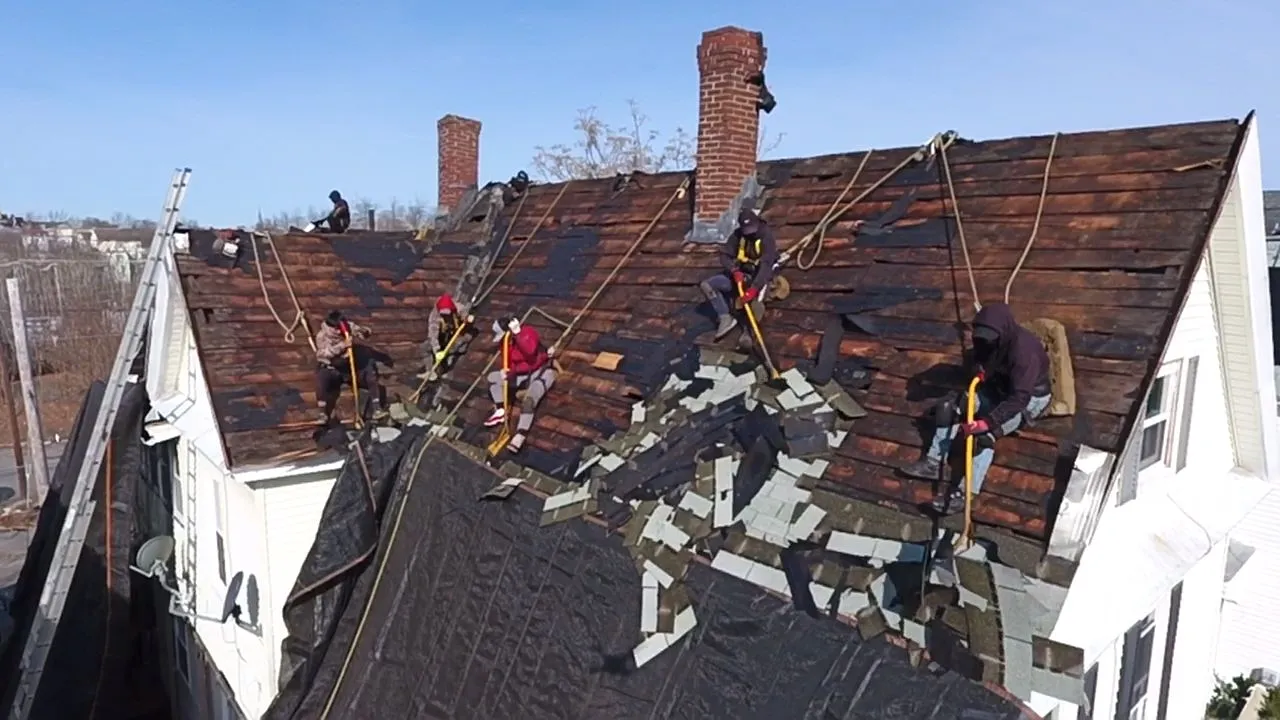 Experienced roofing team replacing fascia boards and soffits in Lowell Massachusetts