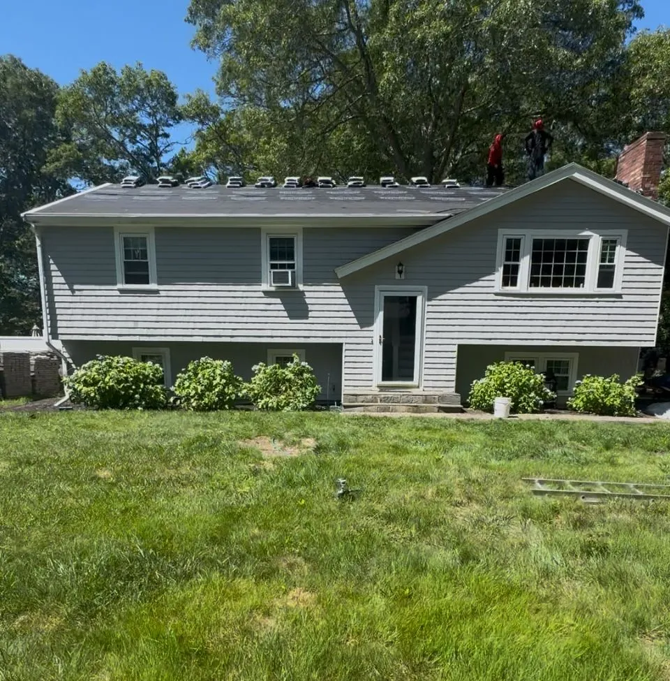 Experienced roofing contractors repairing wind damage in Manchester New Hampshire