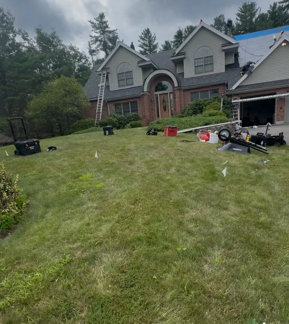 Certified roofing specialists installing ridge vents for proper attic ventilation in MA