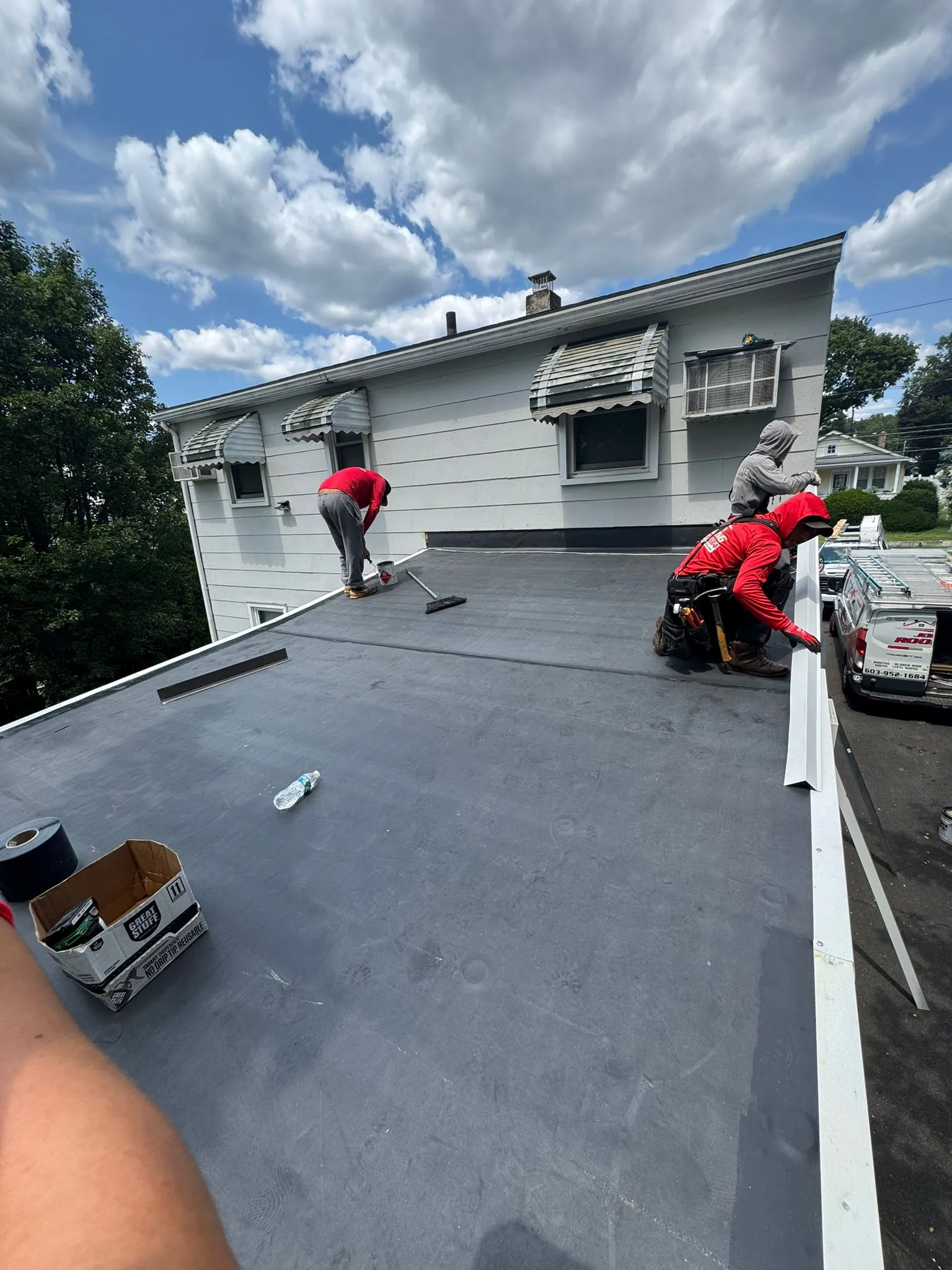 Licensed roofing crew performing complete roof replacement in Massachusetts